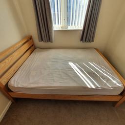 Wooden double bed with slats and mattress. In good condition. Collection only.