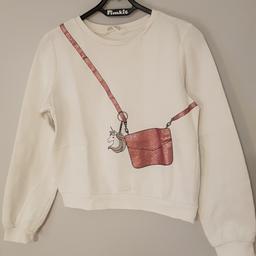 Pullover von H&M mit Glitzertaschenaufdruck und einem Einhorn. 
Farbe: weiß 
Gr. 146/152