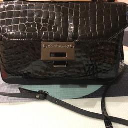 Russell And Bromley black Patent Handbag / Crossbody Crocodile Print. Condition is Used. Collection or pay for 3 extra for postage with royal mail 2ndclass .