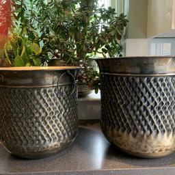 One is Brand new. The larger one with price tags 
16 h x 18 new 
15” h x 16” used 
Bronze colour lovely detail 
Polished base 
Look lovely with plants in 
Matching 
Carry handles 
One has been used  
Also selling other large pant pots. See my other items 
Collect from CM3. Bicknacre.