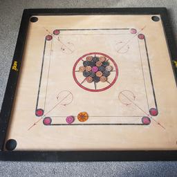 Carrom board..with coins and striker for sale...