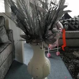White and silver vase around 3ft tall with flowers, from pet and smoke free home