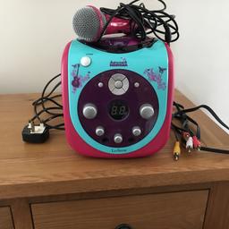 In working condition with leads to connect to the tv. 
Includes microphone.
Hannah Montana karaoke machine