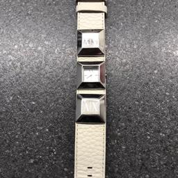 White Armani Exchange watch needs a new battery.