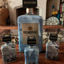 These are empty Disaronno dressed by Diesel 70cl bottle and 3 miniatures. This is only available for 2 months each Year and this sold out everywhere