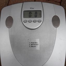 A nice set of silver electronic weighing scales measuring weight in stones, pounds or kilograms settings & in good working order. 07786--012316
