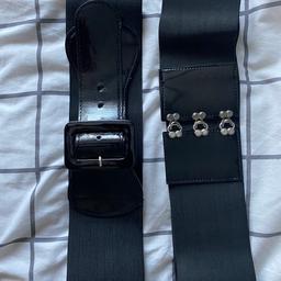 2 Black Elasticated Waist Belts 
Good condition 
Perfect to wear with dresses or oversized jumpers!
One Size