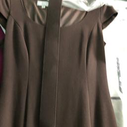 Classic M&S dress brown with thick belt nick used. Size 12 round neck cap sleeve. Also bottom back little kick pleat ( as seen in picture.
 Worn once and dry cleaned. 

Delivery Royal Mail 2nd class signed for 

Bargain