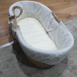 lovely moses basket with wooden rocker used for only a few months as my little one was quick to go into cot