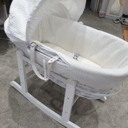 gorgeous basically new moses basket worh white rocker, brought from asda only a few months ago son in cot very quickly so no need for this anymore. comes with lovely little duvet brought only a few months ago for £50