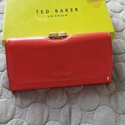 Ted Baker orange purse few Mark's on it and a little worn on the edges but still in ok condition collection only from Mansfield area will not post