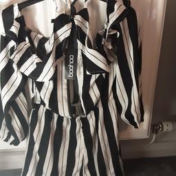 Beautiful size 12, Boohoo playsuit. Brand new with tags on. Open back, ruffles along neckline.