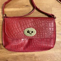 A gorgeous designer brand handbag in 100% genuine red leather with mock crocodile skin outer shell. Internal zip pocket. Only used twice.

Dimensions: 24cm x 16cm