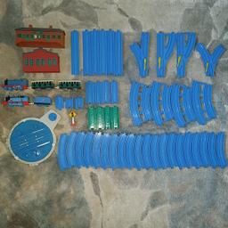 2004 Gullane Limited Tomy Thomas & Friends Trackmaster Blue Track Engine, Shed, Blue Trains Lot Bundle 54 pc. Condition is Used, played with. No any broken parts, except one green wagon back connector). 6 × large collectors, 3 x small blue connectors, 4 x blue, 4 x green connectors, 4 x arrows, 4 x double, 4 x single crescents tracks lines, 1 - round crossroad, 2 - buildings,1 - sign, 2 x Tomy Thomas blue trains, 3 wagons - battery operated, workin order. Smoke-free home. From ME15 