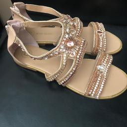 Flat summer shoe sandals with stones.