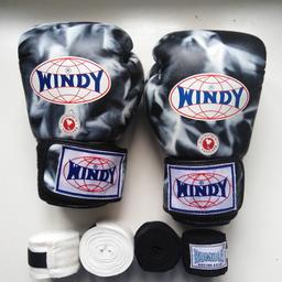 Unisex Leather Windy Amateur Boxing Gloves Rare Print - 12 oz + free pair wrist bandage.

These are worn only a handful of times and do not smell like old sweat!
Unique print, hard to find, Windy gloves for a personal statement.

Throwing in a bonus pair of wrist wrapping, you can pick whether you'd like the black or white bandage!
(used a few times but washed and good to go!)
Please write in notes which you prefer or you get a random pair.

Also selling matching black Windy Shin Guards, see lis