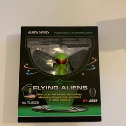 New only opened box to take photos will make a great present. The flying Alien will hover over your hand & other objects.