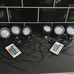 set of 2 pond lights...3 lights to each set...led...colour changing with remote controls. less than 4 months old