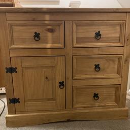 Good used condition with minor marks of wear and tear. 
Solid wood, 4drawers 1cupboard with central diving shelf
Dimensions 91cm wide, 81cm high, 42.5cm deep.
Can deliver locally for fuel costs