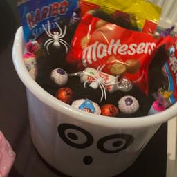 I am making and selling these Halloween buckets can be customised to what names you want The entire bucket is full of sweets