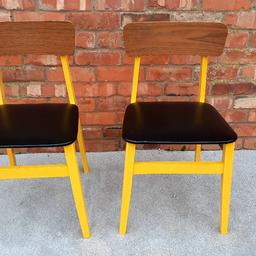 painted gloss yellow but not a good paint job.
may want to repaint .
otherwise sturdy chairs no damage.