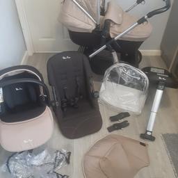 unisex travel system,sand and black colour packs, seat liner,car seat,adapters ,cup holder,rain cover isofix,multifunctional hood,memoryfoam carry cot so soft snugly,main seat with bumper bar  up to age of 3.used travel system, simple to use..clip on off system welcome to view safe distance  and gel provided lol. this is used travel system worth over 800 new