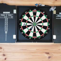 Dart Board used a couple of times comes with 6 darts in very good condition.