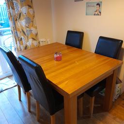 This is a solid oak extending table ,both middle panels are in perfect condition, table has wear n tare but nothing a quick sand down wont fix ,this is a very heavy chunky table ,i didnt take pic of it extended as i cant do it myself because of the heaviness of it ,it has 4 chairs very dark brown perfect condition also heavy ,measurements can be sent if required, will take 2 to lift it it does dismantle, collection only ,masks will be warn by both parties on collection please.NO STUPID OFFERS