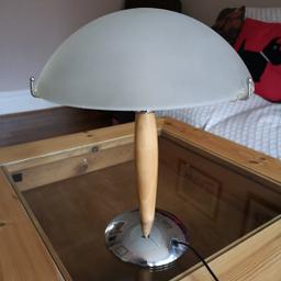 Table Lamp (14" / 36cm high)
With a large frosted glass shade (Diameter: 11"/28cm)
Wooden stem with a chrome base

Excellent Condition

Collection Only Please

Location: Doncaster (5 mins from Junction 36 of A1)