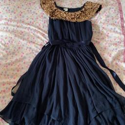 Used just once. As new this lovely blue dress. 12-13 years old. Monsoon the brand.