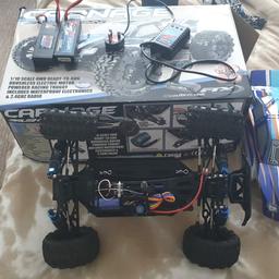 ftx carnage  with lots of extras extremely  good condition  with a complete  spare  roller car two shells charger two remotes instructions  two lipos  box  in very  good condition  it just needs a spur gear  3 pond from penn  models if i get chance  i will get and fit