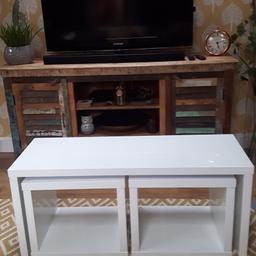 Nest of tables in white gloss,1 large table with 2 smaller cubes that fits underneath. Slight small chip on edge of large table as shown in picture, but otherwise good clean condition.From smoke free home.