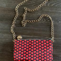 Cute moschino parfums handbag in heart pattern. Bag is in excellent condition.