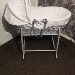 Clair de Lune moses basket, with rocking stand, mattress and fitted sheet included.