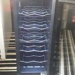 new wine fridge never used in black height 2ft x 10ins w 20 ins long selling as carnt fit in blue light led beautiful when on no offers pick up only haydock no delivery 07930151061