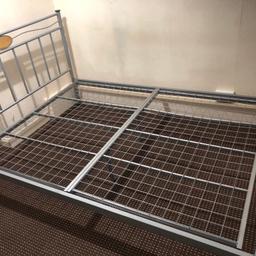 In good condition sliver grey metal double bed frame will be dismantled for easy pick up have all nuts screws for resemble, total size length: 197cm width 143cm hight: 102cm pick up only thanks.