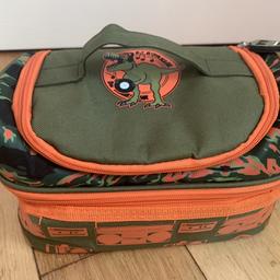 Dinosaur washable lunchbag with multiple pockets. Green and Orange detail. Hardly used so like new. Collection from Wigston LE18. On other sites £3