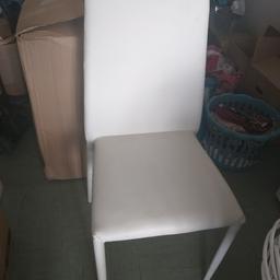 3 white chairs