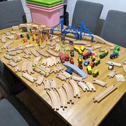 large selection of wooden railway set. 

over 20 vehicles, loads of tracks and little wooden town houses and models. 

some of the wooden pieces have glue stick to one of the sides, but doesn't impact play. majority are in excellent condition.