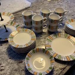 Six cups and saucers, large plate and small bowl.