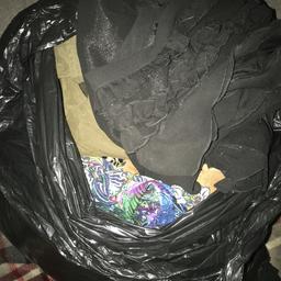 Bin liner full of ladies dresses, tops and coats. Size 16 - 24 all good used condition. Some new.