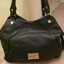 Soft genuine leather, medium black bag. Still in good condition inside and out. Has a long strap too.
