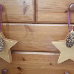 Christmas Decorations - £8.
Wooden Stars, painted with Metallic Gold acrylic, strung with christmas ribbon and finished with pine cones. Star measures 20x20cm