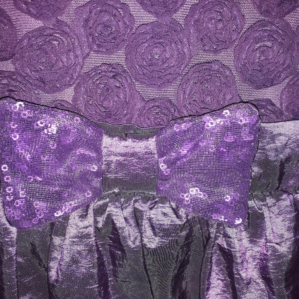 BEAUTIFUL PURPLE PARTY DRESS WITH BOW. LOVELY BODICE. LINED UNDRERSKIRT WITH DOUBLE NYLON EDGING