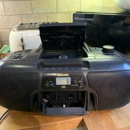 Good condition, boom box, radio, cassette, and cd player and recorder for tapes. Record radio to a mix tape like the good old days. All working perfectly. Mains powered or battery operated for wire free listening. Aerial snapped off but still works perfectly.