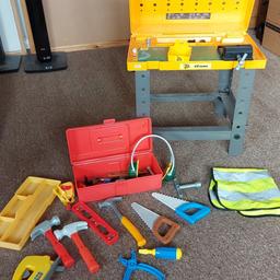 kids builders station and tools. 
collection of builders bits for kids to play with. the hi-viz does have paint splatters on it. everything has been in the attic so is quite dusty, will need a good wipe down.