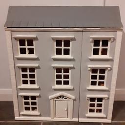 wooden dolls house
comes with loads of wooden furniture
missing both chimneys, but I think one is in the box with the furniture some marks inside
good for a project