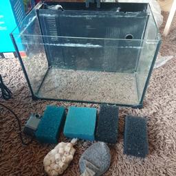 A love fish concept aquarium . It has been used so glass needs a bit of a clean. Comes with light, filter media and lid but no heater. A small pump is included but will need a nozzle to fit into chamber, Therefore there is a hole into media chamber which will need blocking up. Maybe ideal for cold water tank
