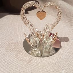pretty little swans with gold heart. small fits in hand. for fireplace or shelves for decoration. great for anniversary present