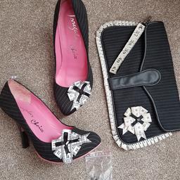 Iconic and much sought after 'Tapetastic' pinstripe court shoes with matching clutch bag.
Shoes are size uk7 / eu40. 
The shoes were second hand and too small for me but in great condition so sadly letting them go as I've never been able to wear them.
Matching clutch bag trimmed in same tapemeasure frill.
Original box.
P&P £8
